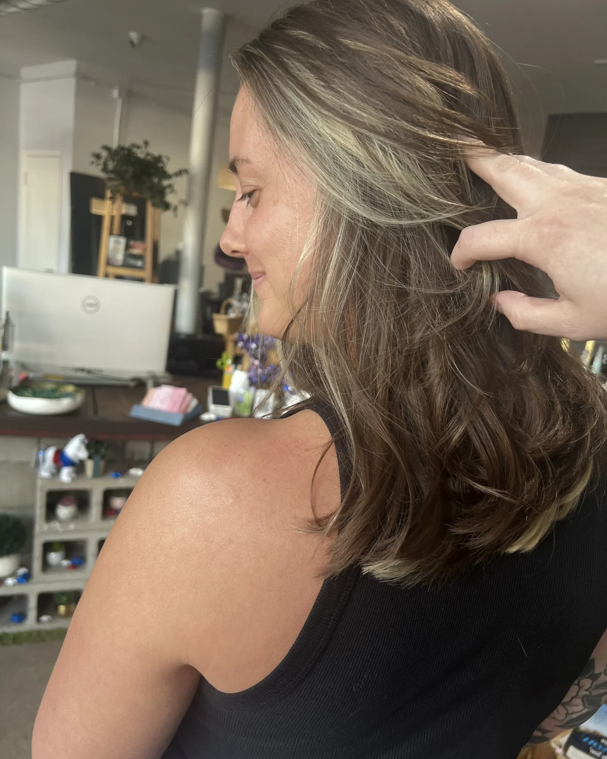 Lived-in balayage with soft face-framing highlights and natural grow-out at Studio 303 in Englewood, Colorado