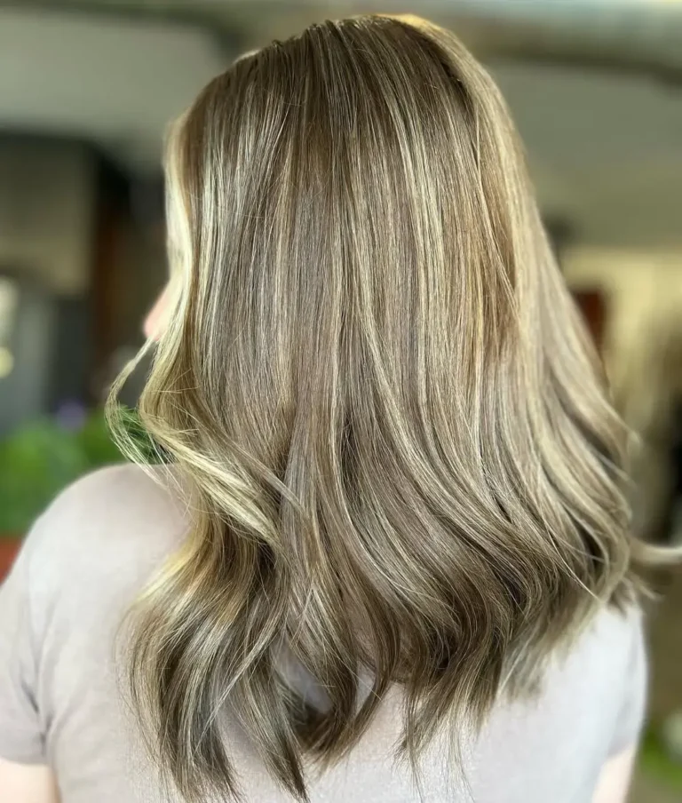 Lived-in blonde balayage with soft dimension and natural grow-out