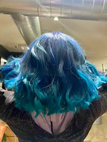 Blue to teal ombre vivid color on wavy bob at Studio 303 hair salon Englewood CO