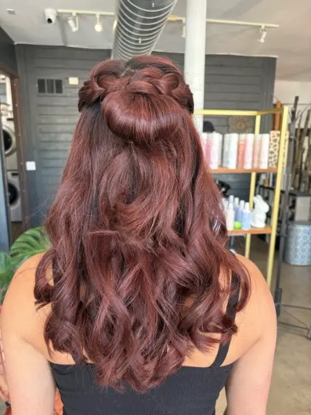 Burgundy auburn color with half up style and waves at Studio 303 hair salon Englewood CO