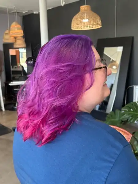 Purple to magenta ombre vivid color on wavy bob at Studio 303 Englewood CO